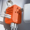 Adapter podróżny do ładowania Matador Global Travel Adapter Forget me not orange