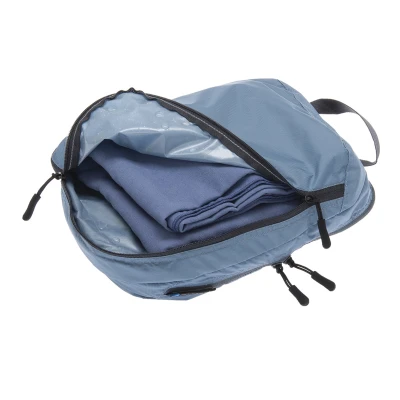 Organizer podróżny z dwiema przegrodami Cocoon Two-in-One Separated Packing Cube Light ash blue L 36 x 26 x 11 cm